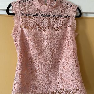 Pink lace top. Never worn but doesn’t have tags.